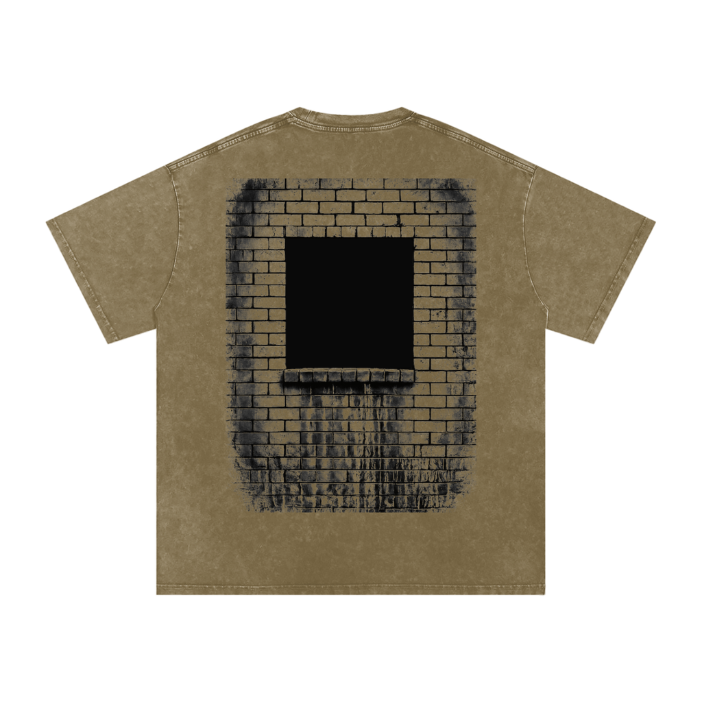 A short-sleeve t-shirt in a washed khaki or olive-brown color, featuring a large graphic print on the back depicting a black square window set within a dark brick wall.